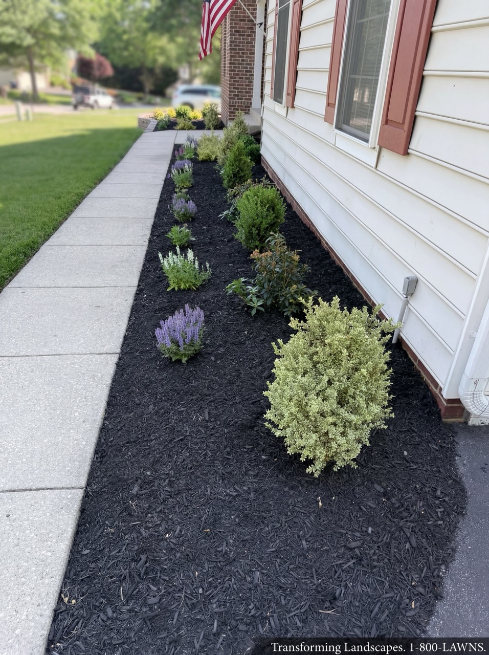 Front-yard landscape bed with mulch and perennials by Green Life